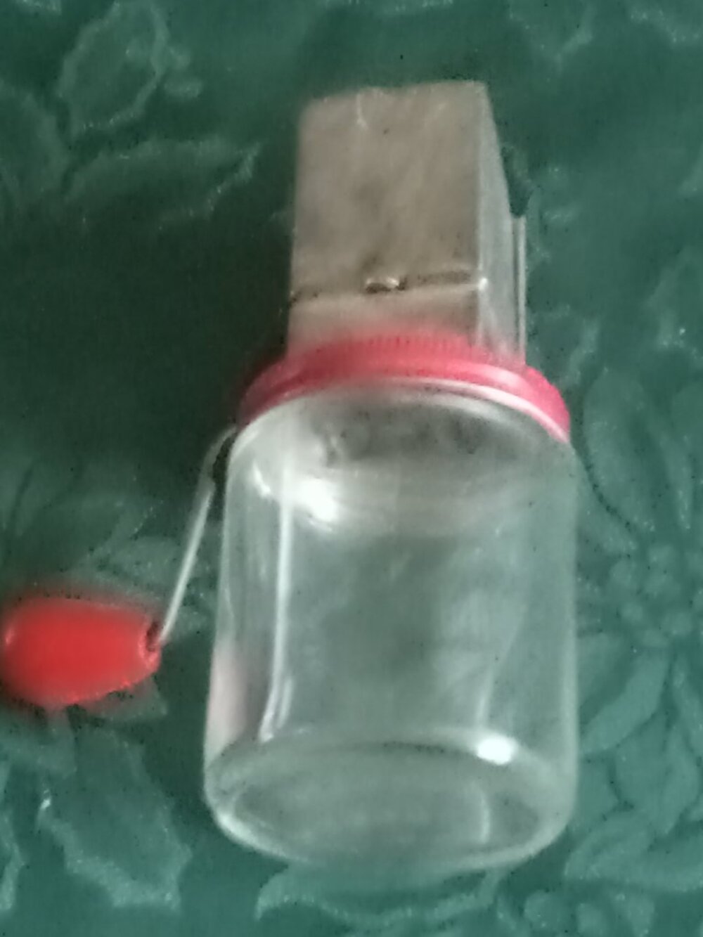 Antique glass jar nut chopper in fair condition for age of item